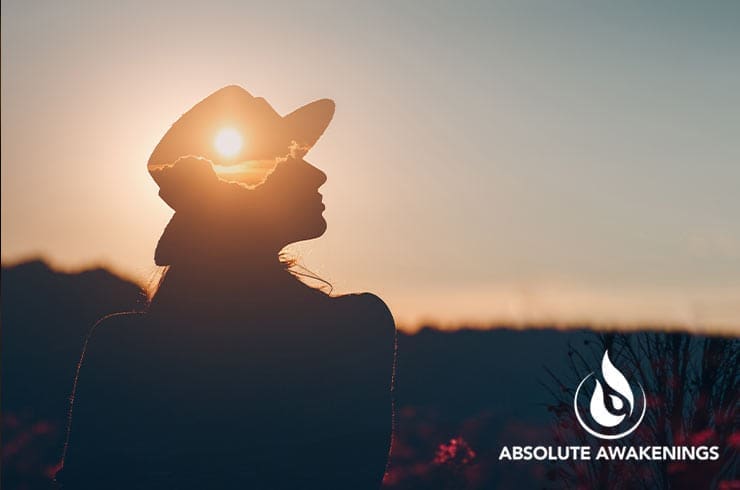 woman wearing a hat outside during dusk